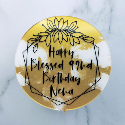 gold marble background for round acrylic cake topper with personalised message